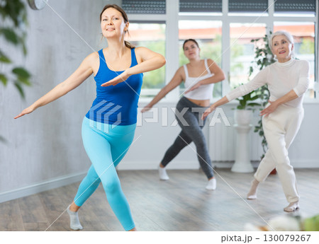 Adult woman dancing in fitness studio 130079267