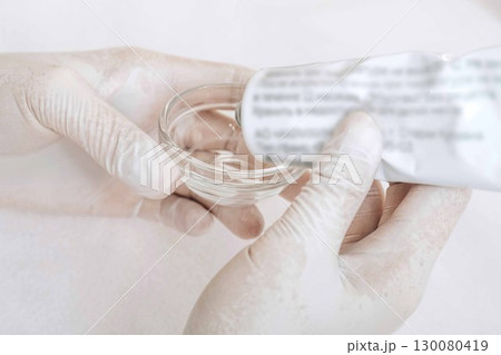 careful preparation of materials for a cosmetic procedure, demonstrating the blend of science and art in dermatology careful preparation of materials for a cosmetic procedure, demonstrating the blend of science and art in dermatology 130080419