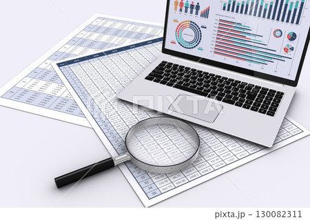 データを表示したノートパソコンとビジネス書類と虫メガネ 130082311