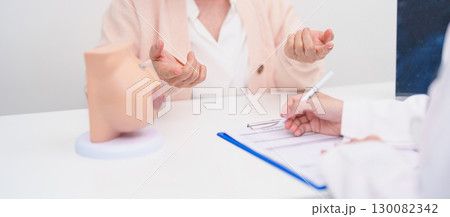 Elderly woman Patient consultation with doctor for Breast Augmentation Surgery, October Breast Cancer Awareness month, implant, Diagnosis, Beauty woman enlargement and medical healthcare concept 130082342