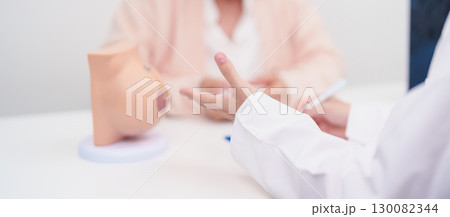 Elderly woman Patient consultation with doctor for Breast Augmentation Surgery, October Breast Cancer Awareness month, implant, Diagnosis, Beauty woman enlargement and medical healthcare concept Elderly woman Patient consultation with doctor for Breast Augmentation Surgery, October Breast Cancer Awareness month, implant, Diagnosis, Beauty woman enlargement and medical healthcare concept 130082344