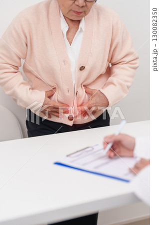 Elderly woman Patient consultation with doctor for Colon disease, Large Intestine, Colorectal cancer, Ulcerative colitis, Diverticulitis, Irritable bowel syndrome, Digestive system and Healthcare 130082350