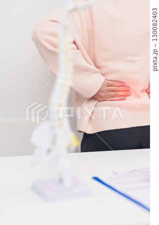 Elderly Patient consulting Doctor with Spine anatomy for Spinal Cord Disorder and disease, Back pain, Lumbar, Sacral pelvis, Cervical neck, Thoracic, Coccyx, Orthopedist, chiropractic, Office Syndrome Elderly Patient consulting Doctor with Spine anatomy for Spinal Cord Disorder and disease, Back pain, Lumbar, Sacral pelvis, Cervical neck, Thoracic, Coccyx, Orthopedist, chiropractic, Office Syndrome 130082403