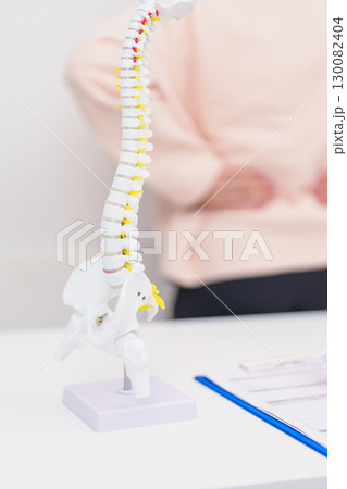 Elderly Patient consulting Doctor with Spine anatomy for Spinal Cord Disorder and disease, Back pain, Lumbar, Sacral pelvis, Cervical neck, Thoracic, Coccyx, Orthopedist, chiropractic, Office Syndrome Elderly Patient consulting Doctor with Spine anatomy for Spinal Cord Disorder and disease, Back pain, Lumbar, Sacral pelvis, Cervical neck, Thoracic, Coccyx, Orthopedist, chiropractic, Office Syndrome 130082404