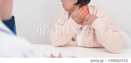 Elderly Woman having Shoulder and Neck and consulting doctor in hospital. Muscle painful due to Myofascial pain syndrome and Fibromyalgia, rheumatism, Scapular pain, Cervical Spine. ergonomic concept Elderly Woman having Shoulder and Neck and consulting doctor in hospital. Muscle painful due to Myofascial pain syndrome and Fibromyalgia, rheumatism, Scapular pain, Cervical Spine. ergonomic concept 130082418