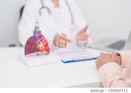Doctor with Respiratory system. Elderly Patient consultation medical health for Lung Cancer, Asthma, Chronic Obstructive Pulmonary, Bronchitis, Emphysema, Cystic Fibrosis, Bronchiectasis, Pneumonia Doctor with Respiratory system. Elderly Patient consultation medical health for Lung Cancer, Asthma, Chronic Obstructive Pulmonary, Bronchitis, Emphysema, Cystic Fibrosis, Bronchiectasis, Pneumonia 130082511