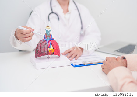 Doctor point Thyroid and Cricoid of Respiratory system anatomy for Diseases. Lung Cancer, Asthma, Chronic Obstructive Pulmonary, Bronchitis, Emphysema, Cystic Fibrosis, Bronchiectasis and Pneumonia Doctor point Thyroid and Cricoid of Respiratory system anatomy for Diseases. Lung Cancer, Asthma, Chronic Obstructive Pulmonary, Bronchitis, Emphysema, Cystic Fibrosis, Bronchiectasis and Pneumonia 130082516