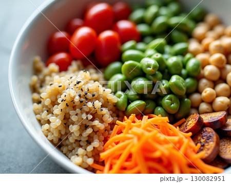 Healthy and Vibrant Grain Bowl with Fresh Vegetables and Toppings 130082951