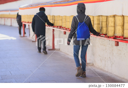 One Tibetan lady Spin the Tibetan Prayer Wheels in Potala place,Lhasa,China 130084477