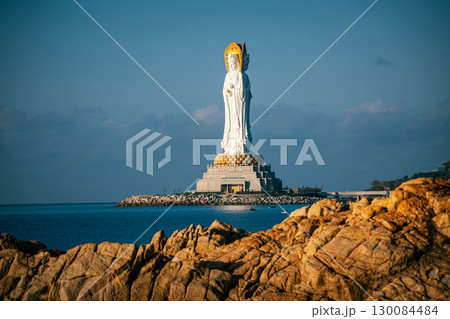 Buddhaism Guanyin statue at seaside in nanshan temple, hainan island , China, Words mean mercy and blessing. Buddhaism Guanyin statue at seaside in nanshan temple, hainan island , China, Words mean mercy and blessing. 130084484