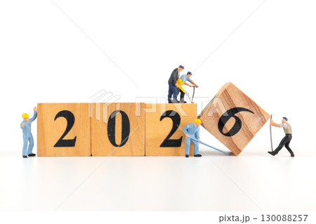 Miniature Workers Building 2026 on Wooden Blocks 130088257