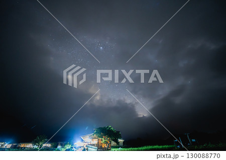 ecology travel night view with camping outdoor relax in rice field at chiangmai thailand in raining season 130088770