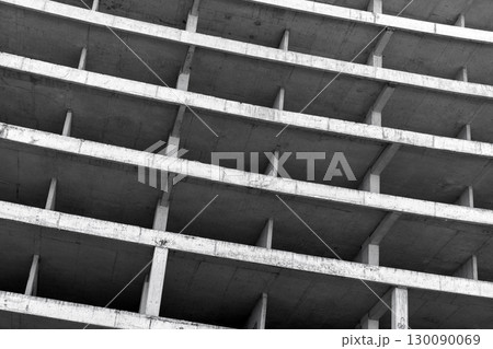Concrete building is under construction, abstract architectural elements 130090069