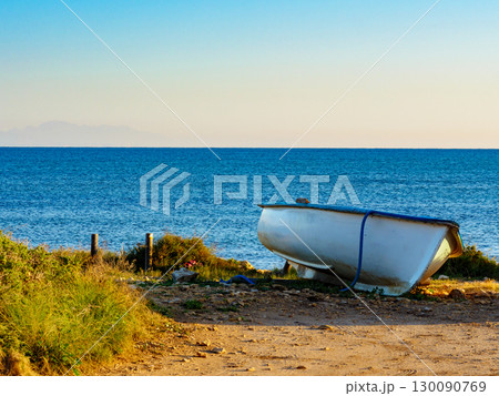Fishing boat on sea shore Fishing boat on sea shore 130090769