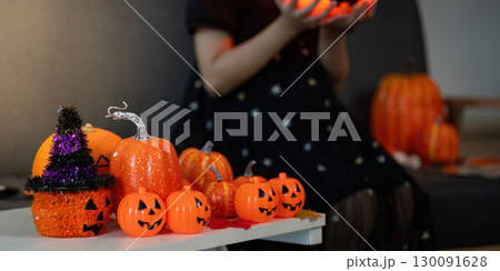 Halloween Decorations. Colorful pumpkins and festive decor for a spooky celebration. Halloween Decorations. Colorful pumpkins and festive decor for a spooky celebration. 130091628