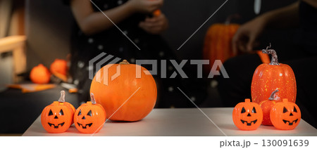 Halloween Decorations. A table filled with festive pumpkins and decorations for Halloween. Halloween Decorations. A table filled with festive pumpkins and decorations for Halloween. 130091639
