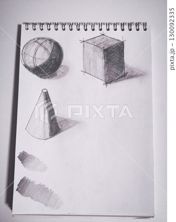 Sketching geometric shapes and shading techniques on spiral bound sketchpad 130092335