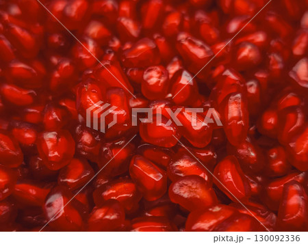 Ripe pomegranate seeds showing their juicy red freshness 130092336
