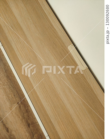 Cable duct concealed under wooden desk in modern office, prague 130092680