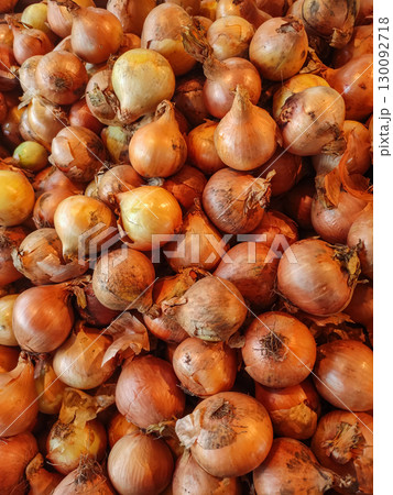 Fresh onions forming a textured background at the market wallpaper copy space Fresh onions forming a textured background at the market wallpaper copy space 130092718