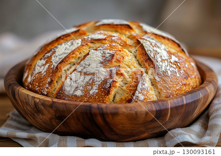 Crusty, golden brown soda bread sits in a wooden bowl, celebrating irish american heritage and national irish american heritage month Crusty, golden brown soda bread sits in a wooden bowl, celebrating irish american heritage and national irish american heritage month 130093161