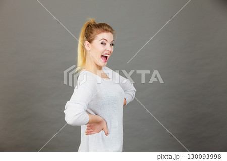 Portrait of happy blonde woman smiling with joy Portrait of happy blonde woman smiling with joy 130093998