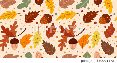 Autumn colorful foliage and acorns on warm background 130094478