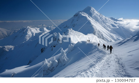 Group of hikers trek across a snowy mountain ridge under clear blue skies, surrounded by towering peaks and pristine winter landscapes. Group of hikers trek across a snowy mountain ridge under clear blue skies, surrounded by towering peaks and pristine winter landscapes. 130094707