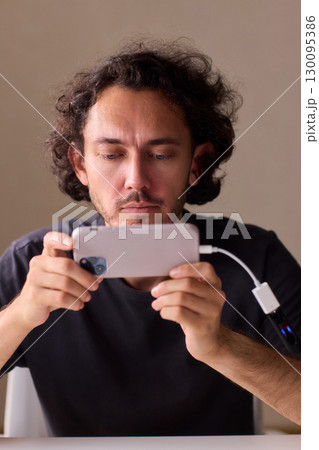 man using otg usb with her mobile phone to copy photos man using otg usb with her mobile phone to copy photos 130095386