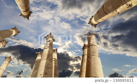 Roman Columns in the Jordanian city of Jerash (Gerasa of Antiquity), capital and largest city of Jerash Governorate, Jordan. Against the background of a beautiful sky with clouds 130095811