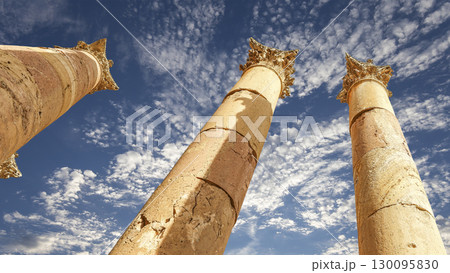 Roman Columns in the Jordanian city of Jerash (Gerasa of Antiquity), capital and largest city of Jerash Governorate, Jordan. Against the background of a beautiful sky with clouds 130095830