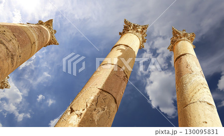 Roman Columns in the Jordanian city of Jerash (Gerasa of Antiquity), capital and largest city of Jerash Governorate, Jordan. Against the background of a beautiful sky with clouds Roman Columns in the Jordanian city of Jerash (Gerasa of Antiquity), capital and largest city of Jerash Governorate, Jordan. Against the background of a beautiful sky with clouds 130095831