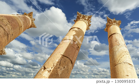 Roman Columns in the Jordanian city of Jerash (Gerasa of Antiquity), capital and largest city of Jerash Governorate, Jordan. Against the background of a beautiful sky with clouds 130095835
