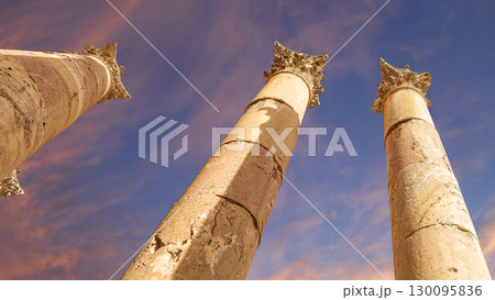 Roman Columns in the Jordanian city of Jerash (Gerasa of Antiquity), capital and largest city of Jerash Governorate, Jordan. Against the background of a beautiful sky with clouds 130095836