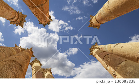 Roman Columns in the Jordanian city of Jerash (Gerasa of Antiquity), capital and largest city of Jerash Governorate, Jordan. Against the background of a beautiful sky with clouds Roman Columns in the Jordanian city of Jerash (Gerasa of Antiquity), capital and largest city of Jerash Governorate, Jordan. Against the background of a beautiful sky with clouds 130095839