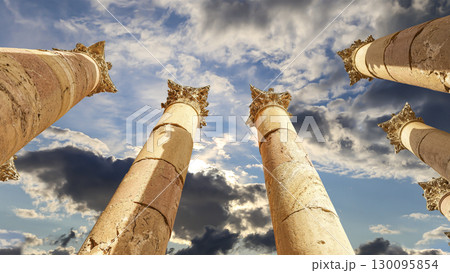 Roman Columns in the Jordanian city of Jerash (Gerasa of Antiquity), capital and largest city of Jerash Governorate, Jordan. Against the background of a beautiful sky with clouds Roman Columns in the Jordanian city of Jerash (Gerasa of Antiquity), capital and largest city of Jerash Governorate, Jordan. Against the background of a beautiful sky with clouds 130095854