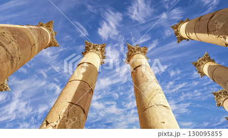 Roman Columns in the Jordanian city of Jerash (Gerasa of Antiquity), capital and largest city of Jerash Governorate, Jordan. Against the background of a beautiful sky with clouds Roman Columns in the Jordanian city of Jerash (Gerasa of Antiquity), capital and largest city of Jerash Governorate, Jordan. Against the background of a beautiful sky with clouds 130095855
