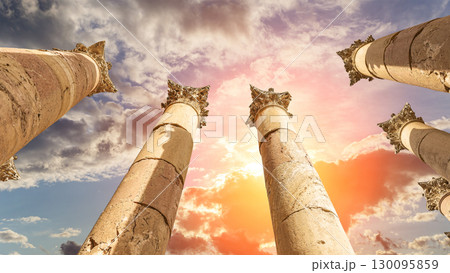Roman Columns in the Jordanian city of Jerash (Gerasa of Antiquity), capital and largest city of Jerash Governorate, Jordan. Against the background of a beautiful sky with clouds 130095859