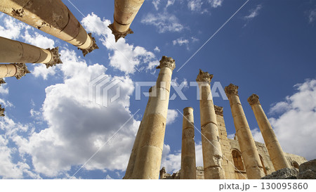 Roman Columns in the Jordanian city of Jerash (Gerasa of Antiquity), capital and largest city of Jerash Governorate, Jordan. Against the background of a beautiful sky with clouds Roman Columns in the Jordanian city of Jerash (Gerasa of Antiquity), capital and largest city of Jerash Governorate, Jordan. Against the background of a beautiful sky with clouds 130095860