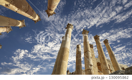 Roman Columns in the Jordanian city of Jerash (Gerasa of Antiquity), capital and largest city of Jerash Governorate, Jordan. Against the background of a beautiful sky with clouds 130095862