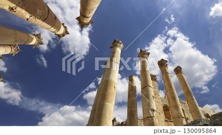 Roman Columns in the Jordanian city of Jerash (Gerasa of Antiquity), capital and largest city of Jerash Governorate, Jordan. Against the background of a beautiful sky with clouds 130095864