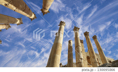 Roman Columns in the Jordanian city of Jerash (Gerasa of Antiquity), capital and largest city of Jerash Governorate, Jordan. Against the background of a beautiful sky with clouds 130095866