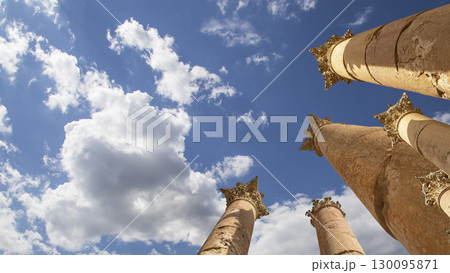 Roman Columns in the Jordanian city of Jerash (Gerasa of Antiquity), capital and largest city of Jerash Governorate, Jordan. Against the background of a beautiful sky with clouds 130095871