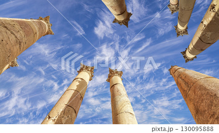 Roman Columns in the Jordanian city of Jerash (Gerasa of Antiquity), capital and largest city of Jerash Governorate, Jordan. Against the background of a beautiful sky with clouds 130095888