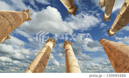 Roman Columns in the Jordanian city of Jerash (Gerasa of Antiquity), capital and largest city of Jerash Governorate, Jordan. Against the background of a beautiful sky with clouds Roman Columns in the Jordanian city of Jerash (Gerasa of Antiquity), capital and largest city of Jerash Governorate, Jordan. Against the background of a beautiful sky with clouds 130095889