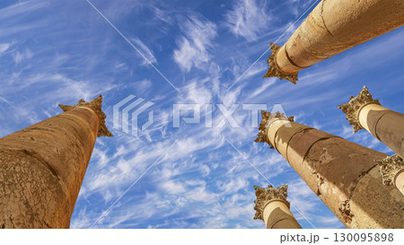 Roman Columns in the Jordanian city of Jerash (Gerasa of Antiquity), capital and largest city of Jerash Governorate, Jordan. Against the background of a beautiful sky with clouds Roman Columns in the Jordanian city of Jerash (Gerasa of Antiquity), capital and largest city of Jerash Governorate, Jordan. Against the background of a beautiful sky with clouds 130095898