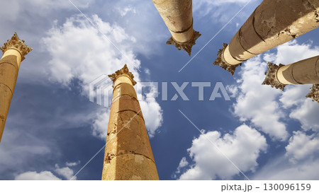 Roman Columns in the Jordanian city of Jerash (Gerasa of Antiquity), capital and largest city of Jerash Governorate, Jordan. Against the background of a beautiful sky with clouds 130096159