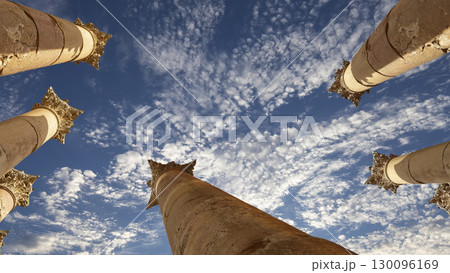 Roman Columns in the Jordanian city of Jerash (Gerasa of Antiquity), capital and largest city of Jerash Governorate, Jordan. Against the background of a beautiful sky with clouds Roman Columns in the Jordanian city of Jerash (Gerasa of Antiquity), capital and largest city of Jerash Governorate, Jordan. Against the background of a beautiful sky with clouds 130096169