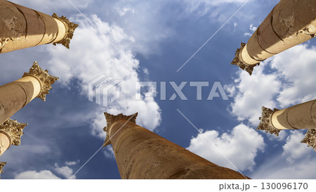 Roman Columns in the Jordanian city of Jerash (Gerasa of Antiquity), capital and largest city of Jerash Governorate, Jordan. Against the background of a beautiful sky with clouds Roman Columns in the Jordanian city of Jerash (Gerasa of Antiquity), capital and largest city of Jerash Governorate, Jordan. Against the background of a beautiful sky with clouds 130096170