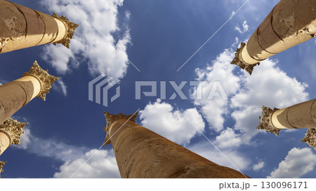 Roman Columns in the Jordanian city of Jerash (Gerasa of Antiquity), capital and largest city of Jerash Governorate, Jordan. Against the background of a beautiful sky with clouds Roman Columns in the Jordanian city of Jerash (Gerasa of Antiquity), capital and largest city of Jerash Governorate, Jordan. Against the background of a beautiful sky with clouds 130096171